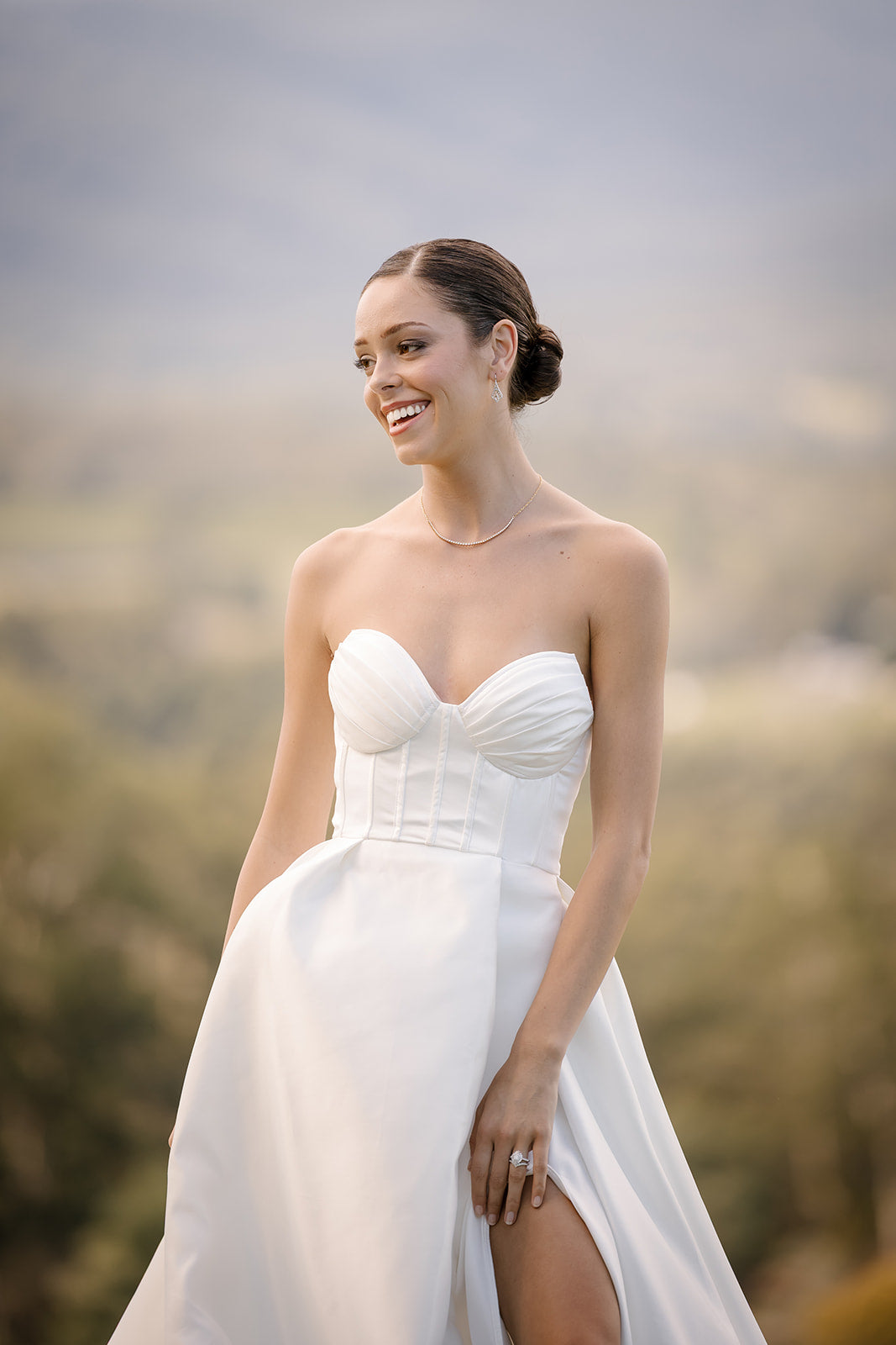 Sleek low bun with soft glam