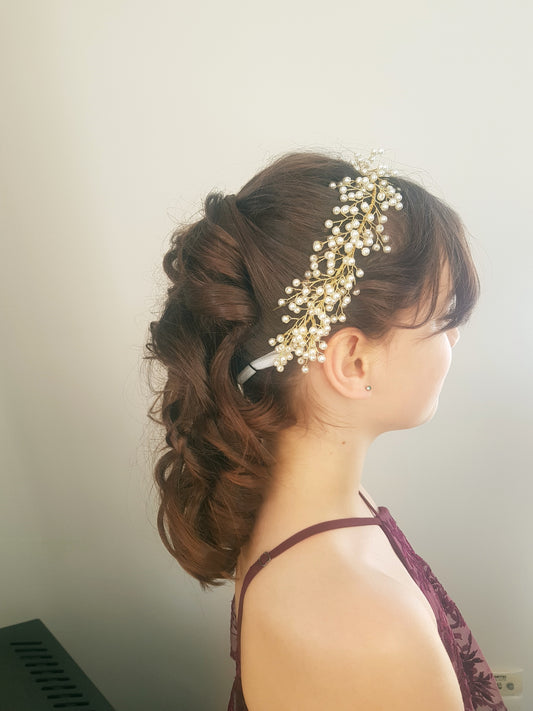 Flower girls soft curls pinned back