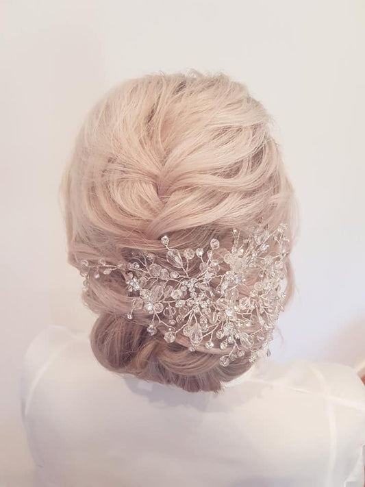 Soft  low bun with braid down top