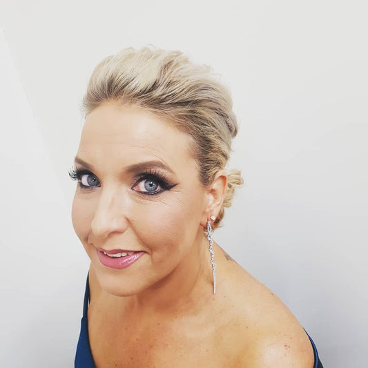 Glam Makeup with wing and soft low bun