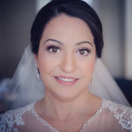 Soft natural Makeup with sleek low bun