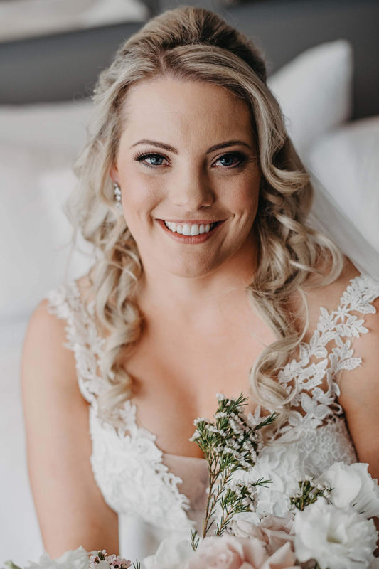 Soft Bridal makeup with soft curls pinned back