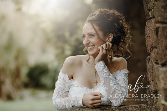 Bridal curly high bun with Bridal Makeup